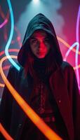 Mystical hooded figure amidst vibrant abstract light trails symbolizing contemporary digital aesthetics photo