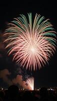 Fireworks create festive abstract holiday atmosphere at night photo