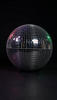 Isolated disco ball against black background photo