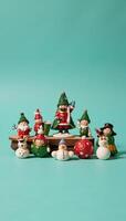 A vibrant arrangement of mini holiday decorations on a teal background during wintertime photo
