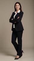 A portrait featuring a businesswoman posed confidently with arms folded photo