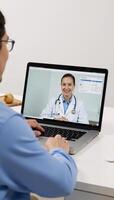 Virtual health consult via laptop technology photo