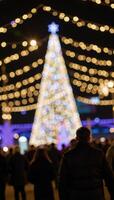 An abstract holiday scene features celebratory firework bokeh and golden festive glitter lights against a blueandblack backdrop photo