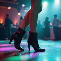 A vibrant dancefloor scene features a dancer wearing black boots grooving away photo
