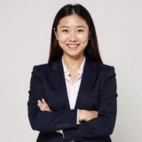 Isolated on white background A successful businesswoman smiles confidently with crossed arms and looks directly at the camera Positive Businessoriented photo