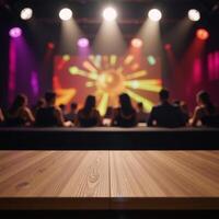 An empty wooden table stands amidst a blurred disco club backdrop for product demonstration photo