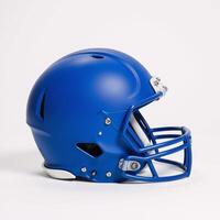 An asymmetric blue football helmet stands alone against a pure white background photo
