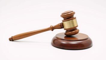 Wooden judges gavel on a plain backdrop embodies power fairness and legal principles photo