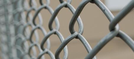Industrial park Metal chainlink fence for security photo