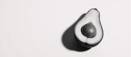 Sketch of half an avocado with pit engraved on scratchboard rendered as blackandwhite raster art photo