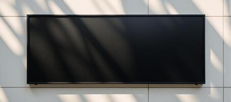 Minimalist scene blank black billboard on modern tiled wall illuminated by sunshine monochrome minimalistic simple photo