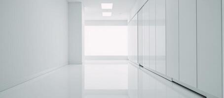 Large empty room featuring only white cabinets and a white floor photo