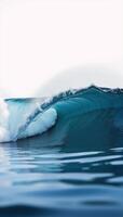 A closeup of an isolated blue ocean wave against a blank backdrop photo