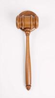 Wooden judges gavel on a plain backdrop embodies power fairness and legal principles photo