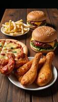 Fast food top view unhealthy meals with sauces on wooden table photo