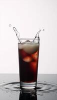 Black refreshment on a white background with splatters photo
