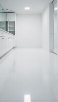 Large empty room featuring only white cabinets and a white floor photo
