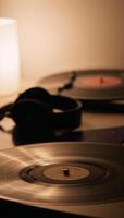 Cozy lofi music scene featuring vinyl records headphones and ambient light photo