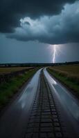 Stormtossed road with distant lightning and ominous clouds photo