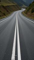 A roadway defined by painted white lines photo