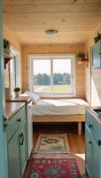 Cozy compact tiny house floor plan including essential amenities and sleeping area featuring a large windows to let natural light inside photo