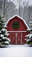 A charming winter scene featuring a festively decorated red barn amidst snowy evergrees photo