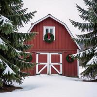 A charming winter scene featuring a festively decorated red barn amidst snowy evergrees photo