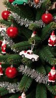 A vintagethemed Christmas tree adorned with classic Santas and old toy cars photo