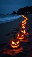 Spooky Halloween beach scene with lit pumpkins by the shoreline photo