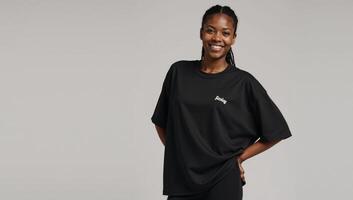 Oversized Black TShirt Mockup featuring confident African American Model displaying casual styles versatility comfort photo