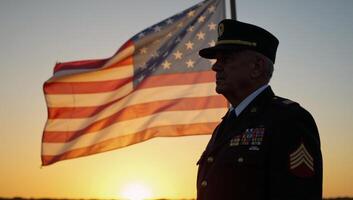 An old veteran silhouetted against the setting sun depicted on the U photo
