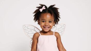 Isolated on white background happy cute African American girl wearing a costume featuring butterfly wings photo