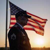 An old veteran silhouetted against the setting sun depicted on the U photo