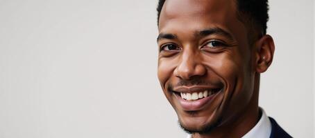 Closeup image of an African American man with smile gazes directly at the viewer photo