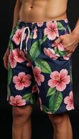 Stylish vibrant hibiscusprinted floral shorts tropical design with an elastic waistband for both beach and casual outfits photo