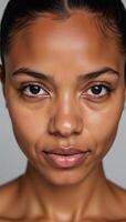 Closeup portrait of an African American woman with striking blue eyes and an intense gaze photo