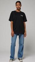 Oversized Black TShirt Mockup featuring confident African American Model displaying casual styles versatility comfort photo
