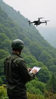 Soldier using drone in misty forest landscape photo