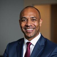 A successful African American business executive smiles confidently photo
