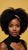 70sinspired portrait featuring an African American woman wearing a retro hairstyle with a large afro and headband photo