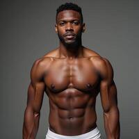 A powerful portrait showcases an accomplished African American football player with confidence photo