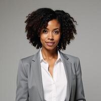A selfassured African American woman is depicted wearing a stylish natural hairstyle photo