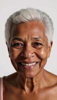 Closeup portrait of wise and graceful elderly African American woman with gray hair on simple white backdrop photo