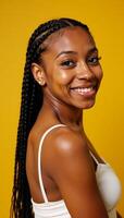 A striking AfroAmerican woman with intricate braids poses against a vibrant backdrop in a modern chic studio setting photo