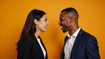 Black AfricanAmerican Couple in heated confrontation against an orange backdrop photo