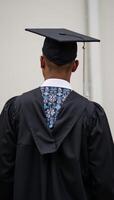 AfricanAmerican graduate in cap gown unidentifiable Black student photo