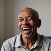 An older AfricanAmerican man radiating confidence as he laughs authentically photo