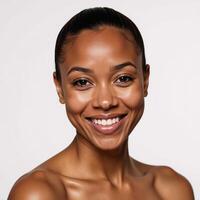 Smiling AfricanAmerican woman isolated against white background photo