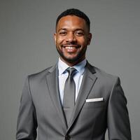 Confident businessman smiles in grey suit professional portrait captures success concept ideal for corporate use photo