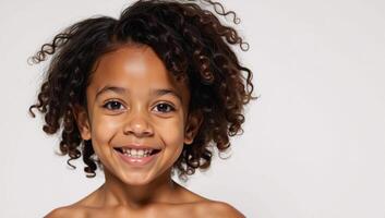 Adorable AfricanAmerican girl with curls and a splash on a clean white backdrop photo